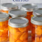 Glass jars filled with round chunks of carrots.