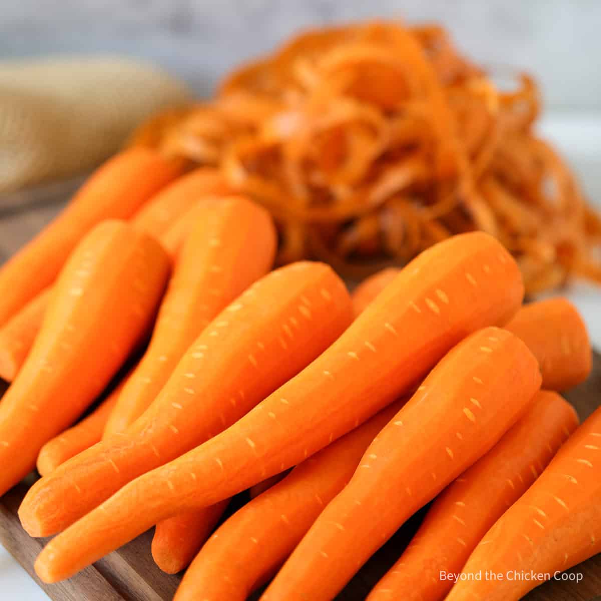 Peeled carrots on a board.