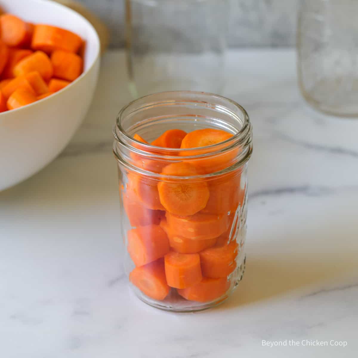 Cut carrots in a glass jar.