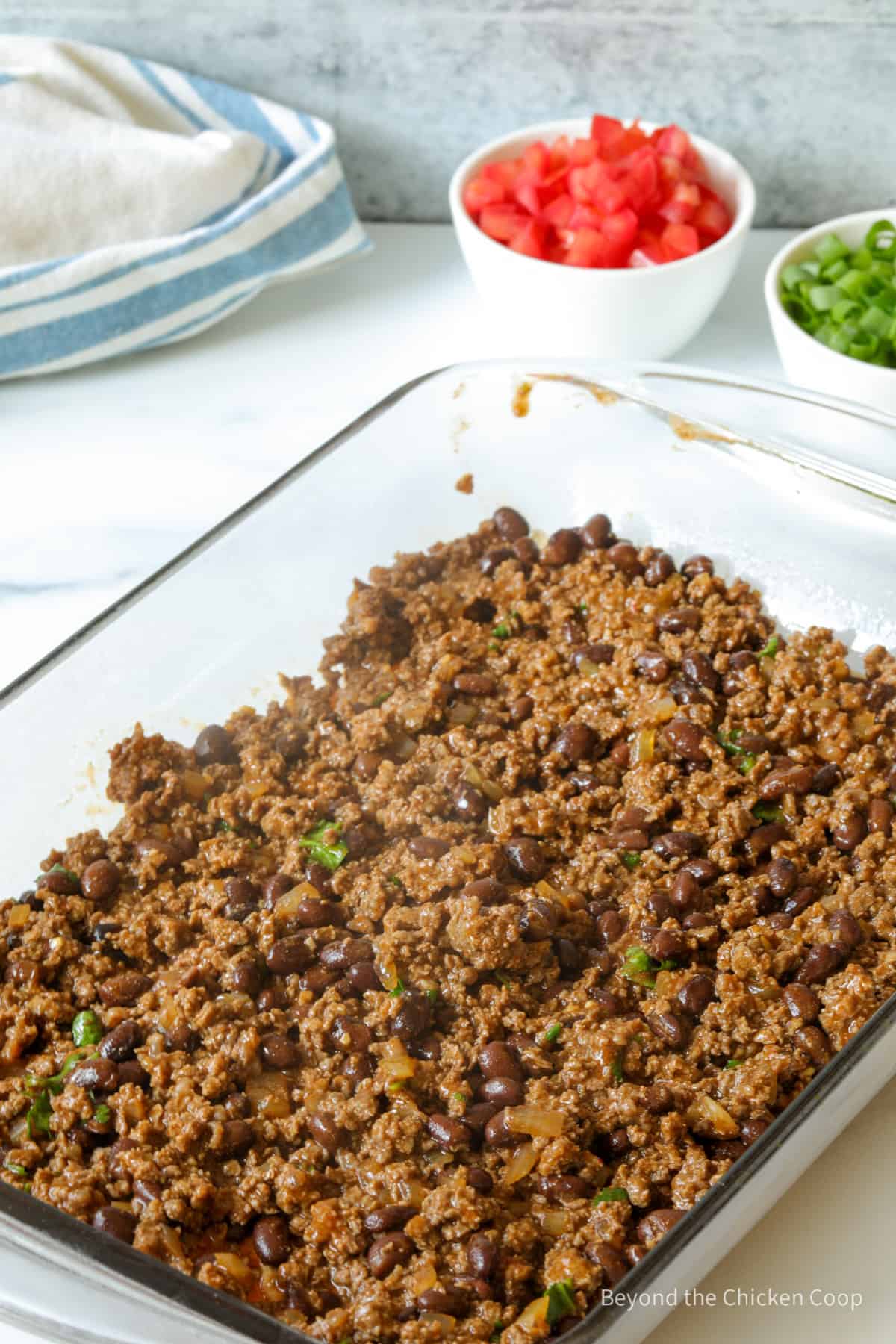 Ground burger in a casserole dish.