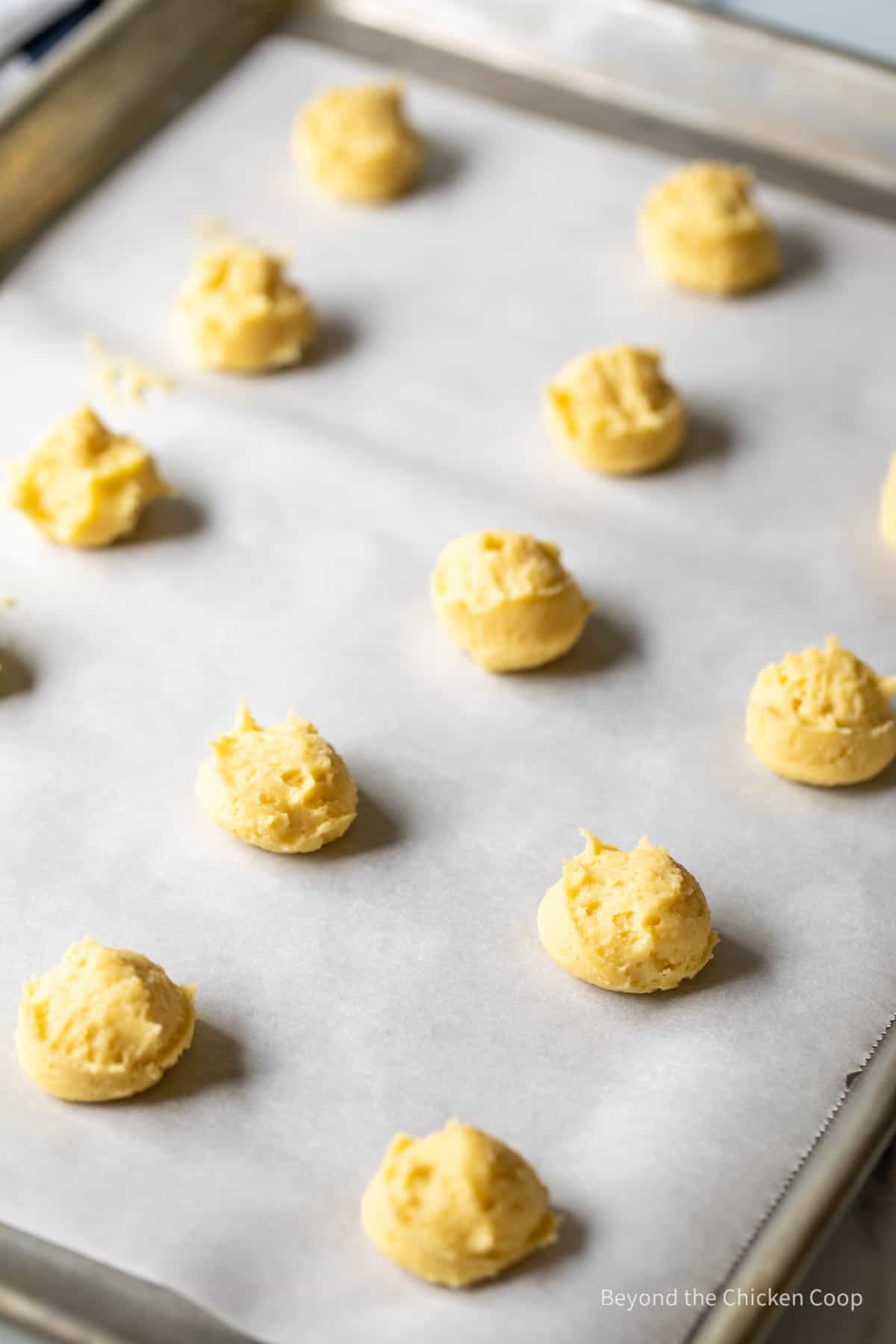 Cookie dough on a baking sheet.