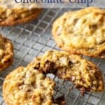 A broken cookie on a baking rack.