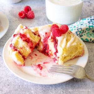 A sweet roll filled with raspberries.
