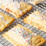 Breakfast pastry with sprinkles on a baking rack.