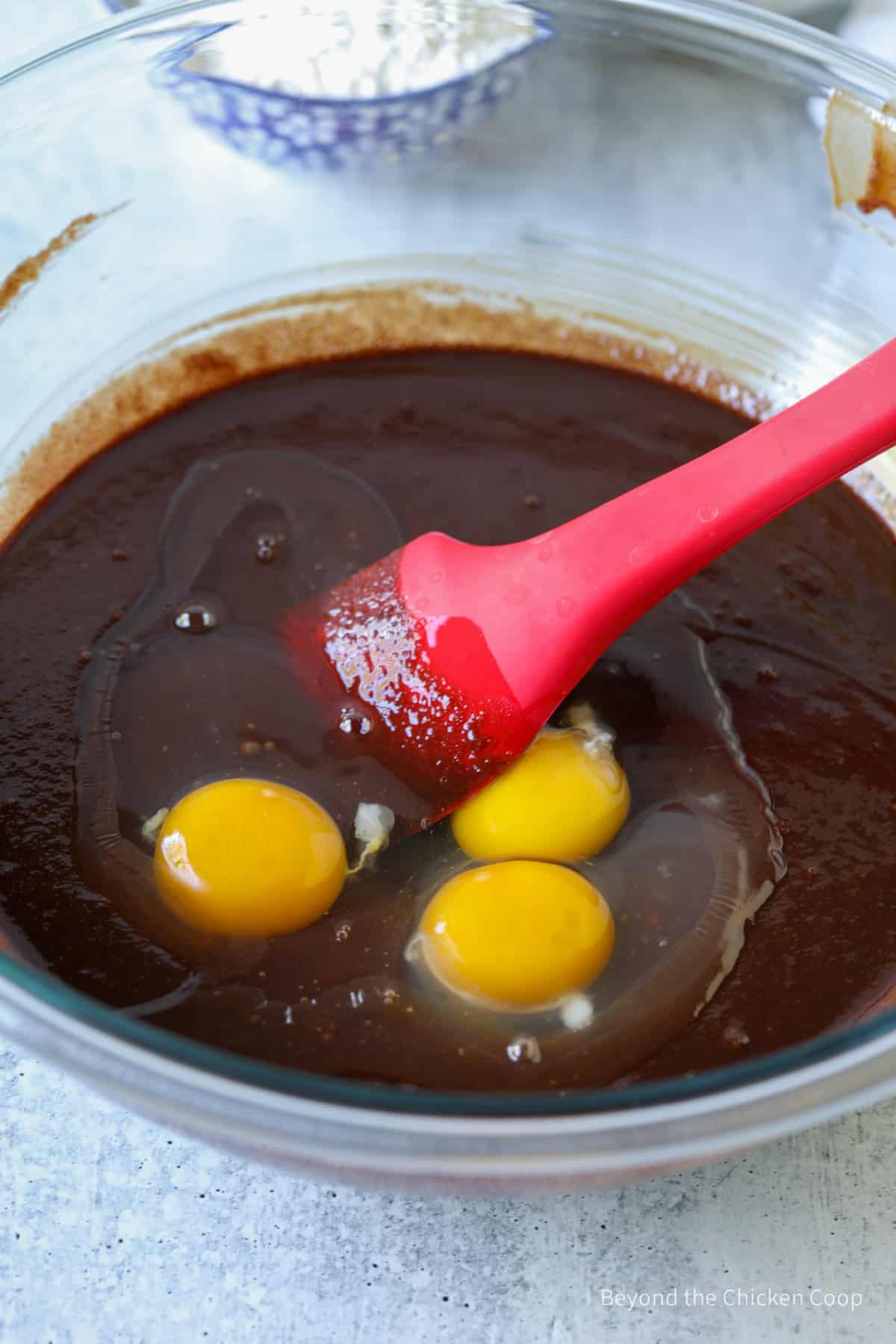 Eggs added to melted chocolate.