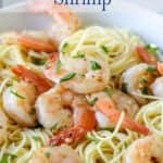 Pasta topped with cooked shrimp.