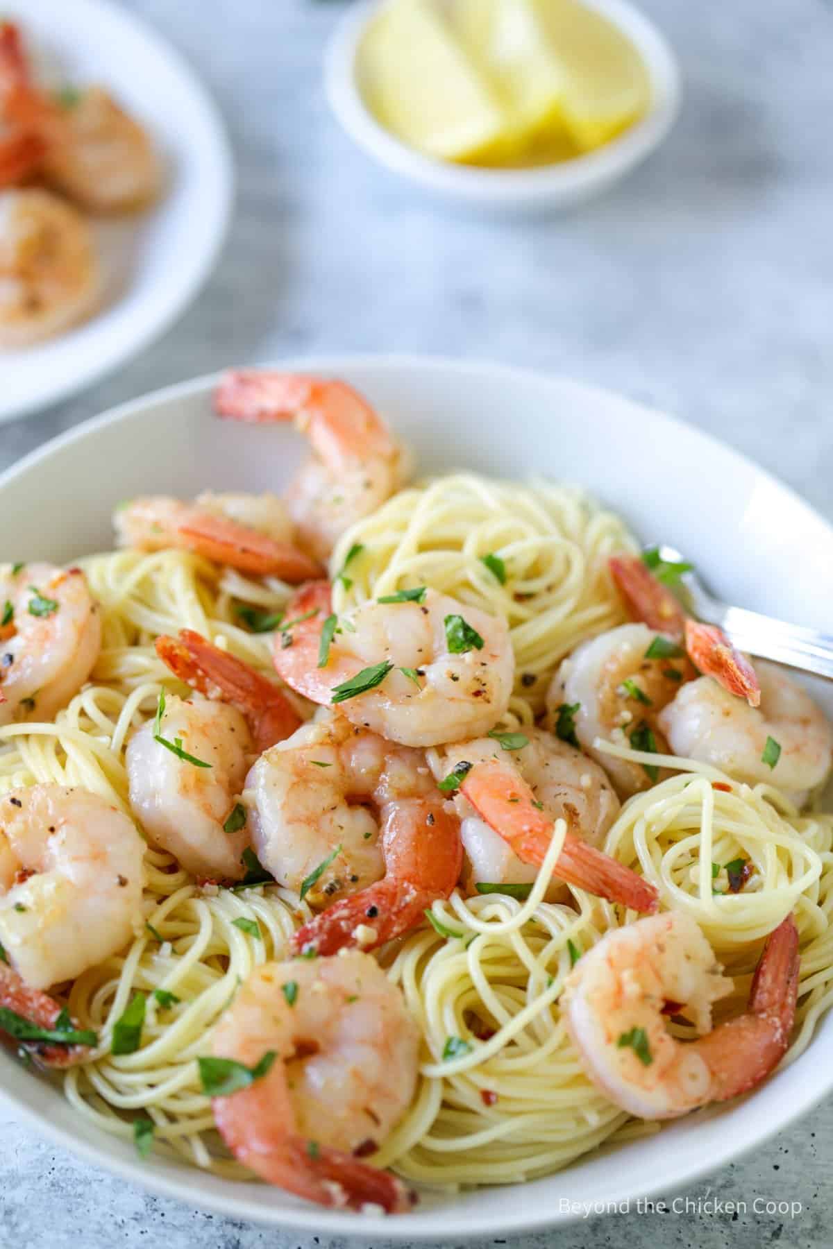 Shrimp and pasta in a bowl.