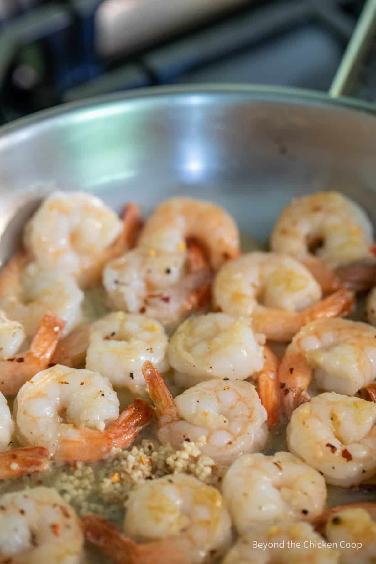 Shrimp cooking in a pan.