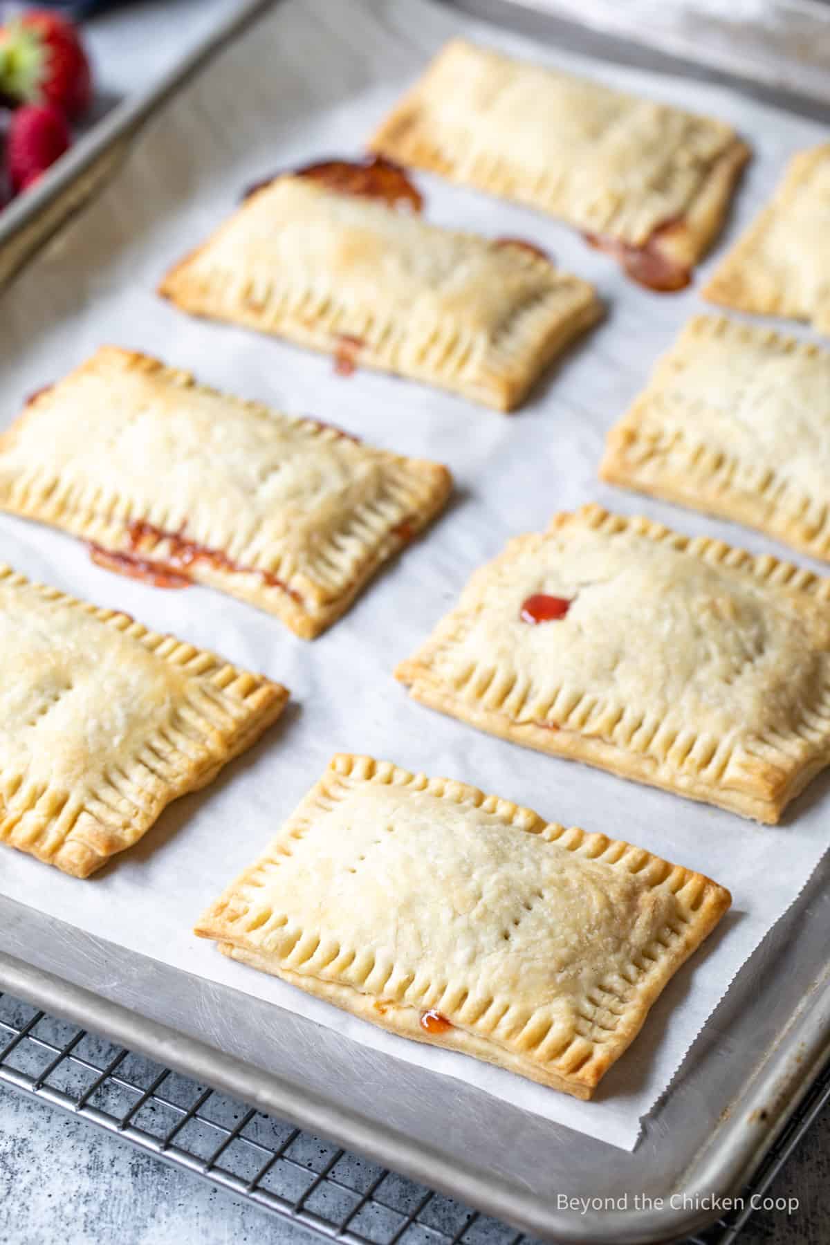 Rectangular mini pies on a baking sheet.