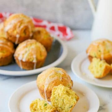 Muffins on a plat with one muffin split in half.