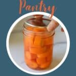 A pint sized jar filled with sliced carrots.