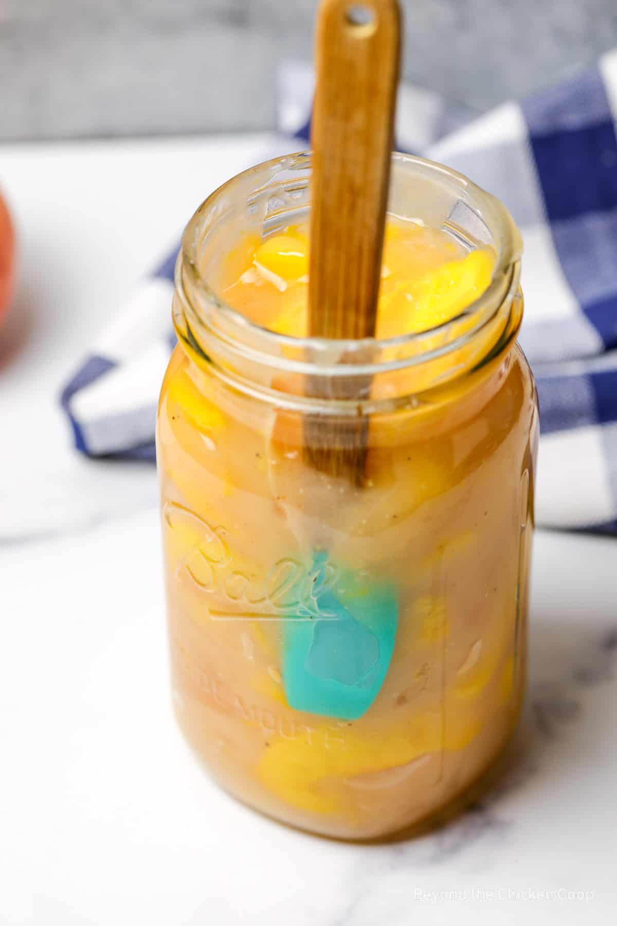 Removing a few of the larger air pockets from a jar of pie filling.