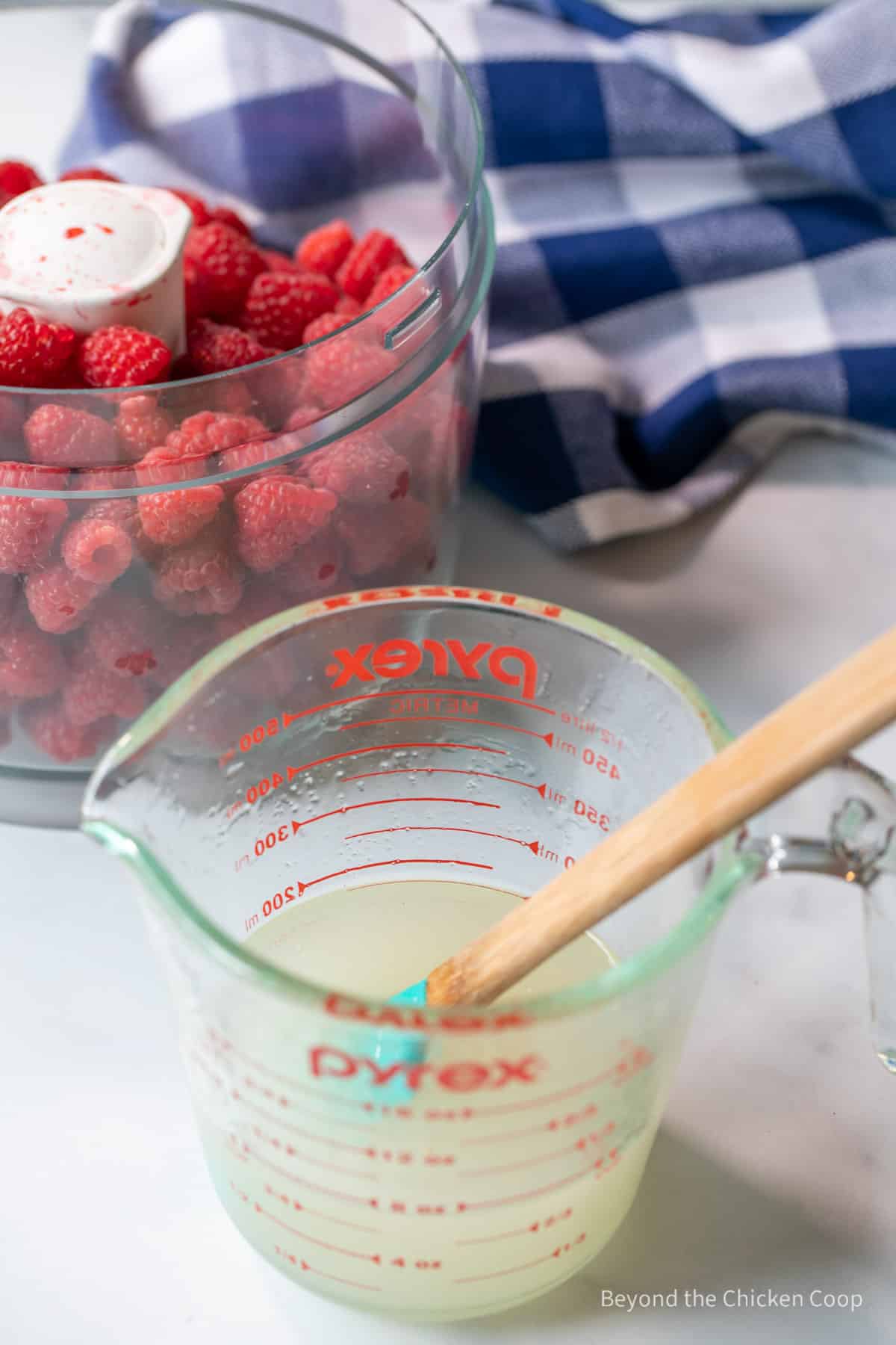 Sugar syrup in a glass measuring cup.