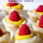 Small tarts filled with lemon and topped with a raspberry.