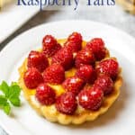 A small tart filled with fresh raspberries.