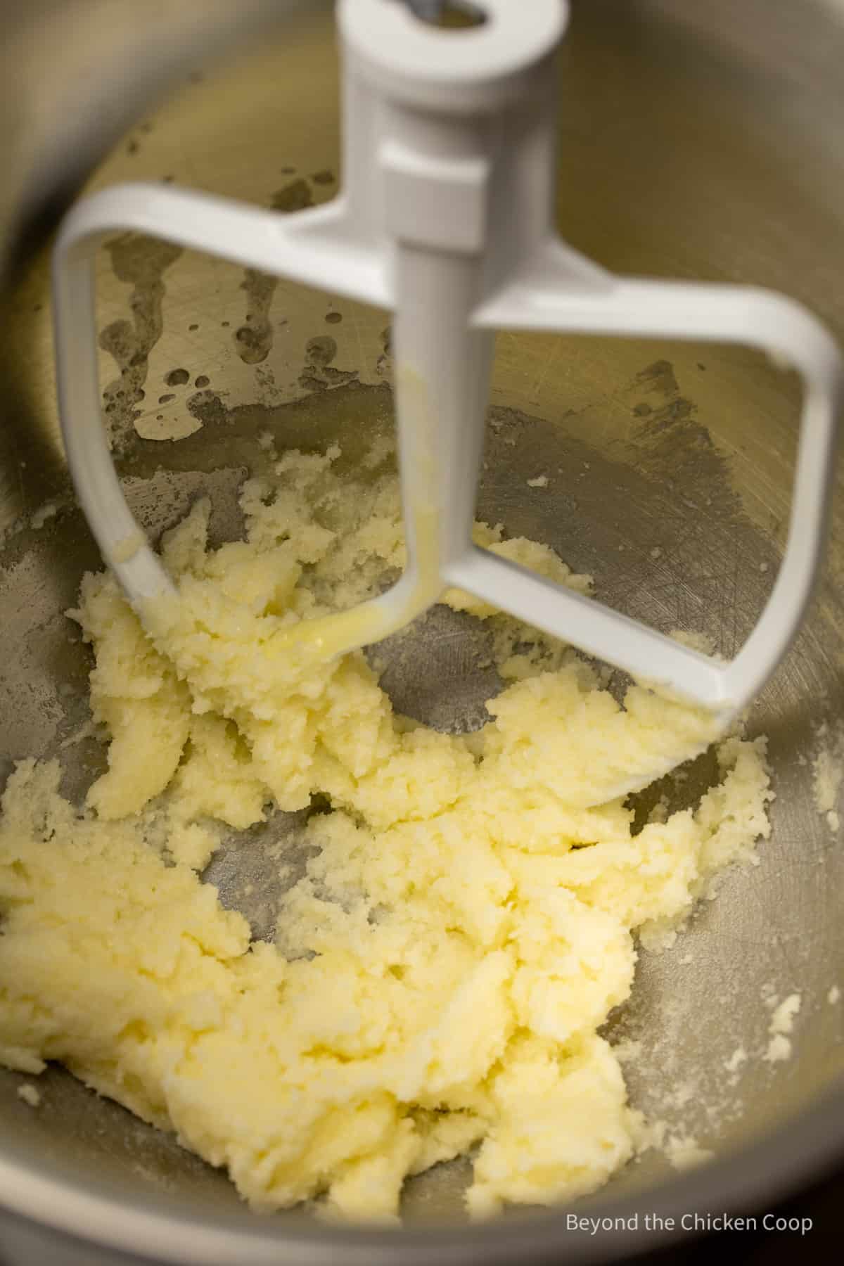 Butter and sugar in a mixing bowl.