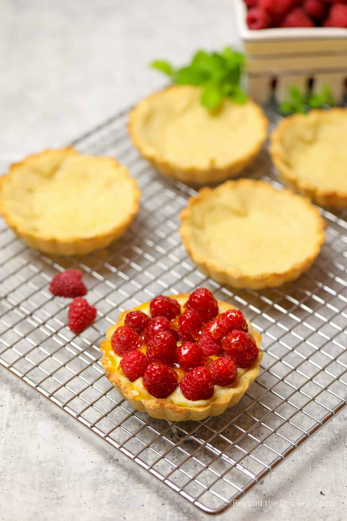 A tart filled with raspberries.