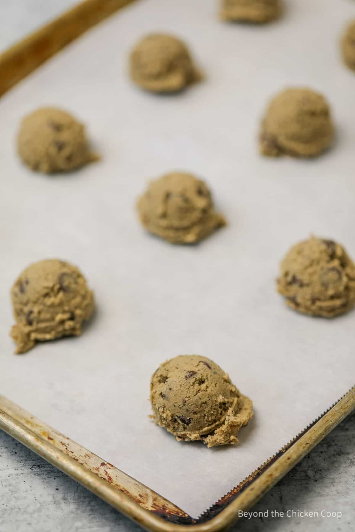 Unbaked cookies on a baking sheet.