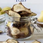 Layers of dried pears in a glass crock.