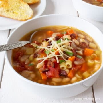 A bowl of soup with beans.