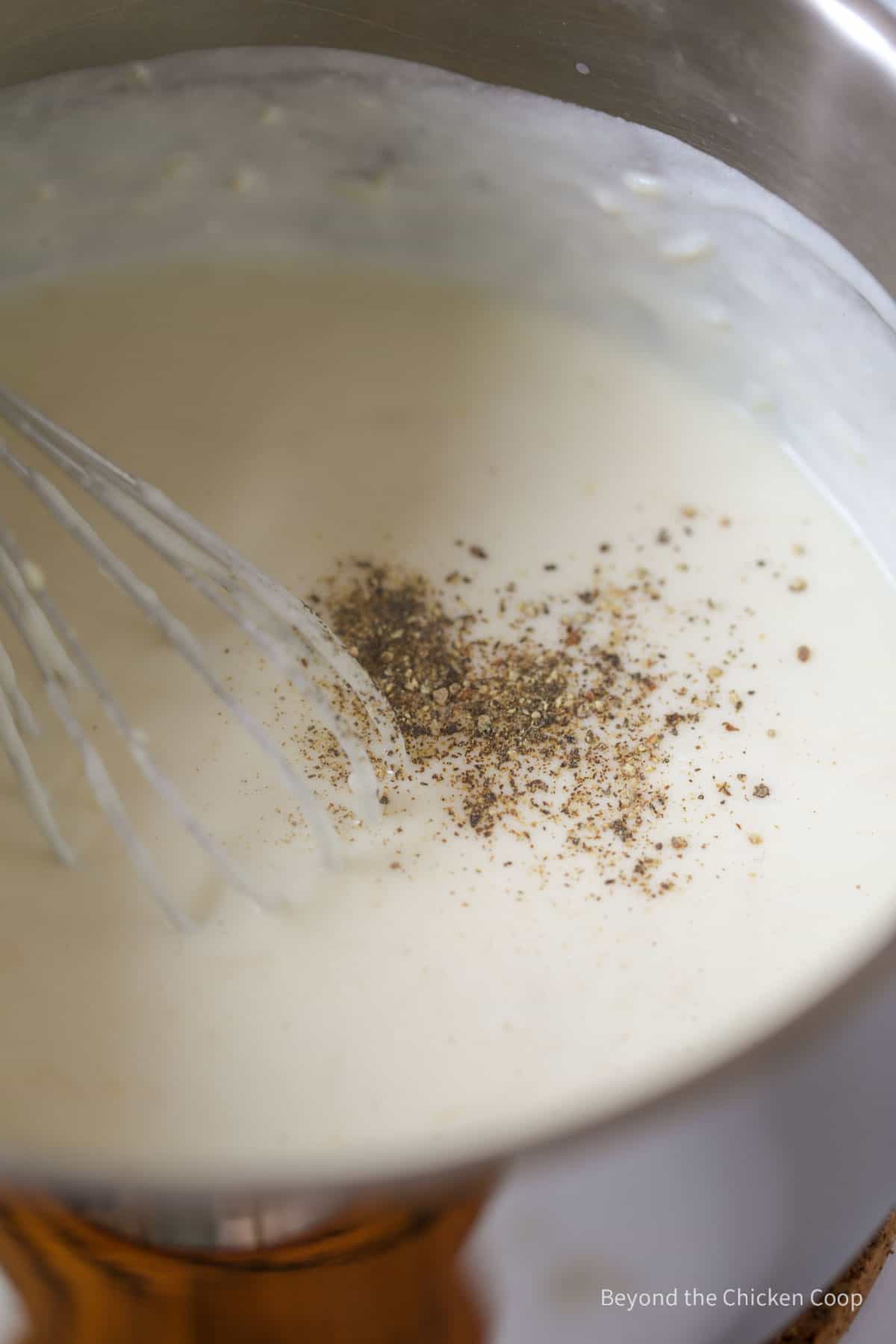 Pepper added to an alfredo sauce.