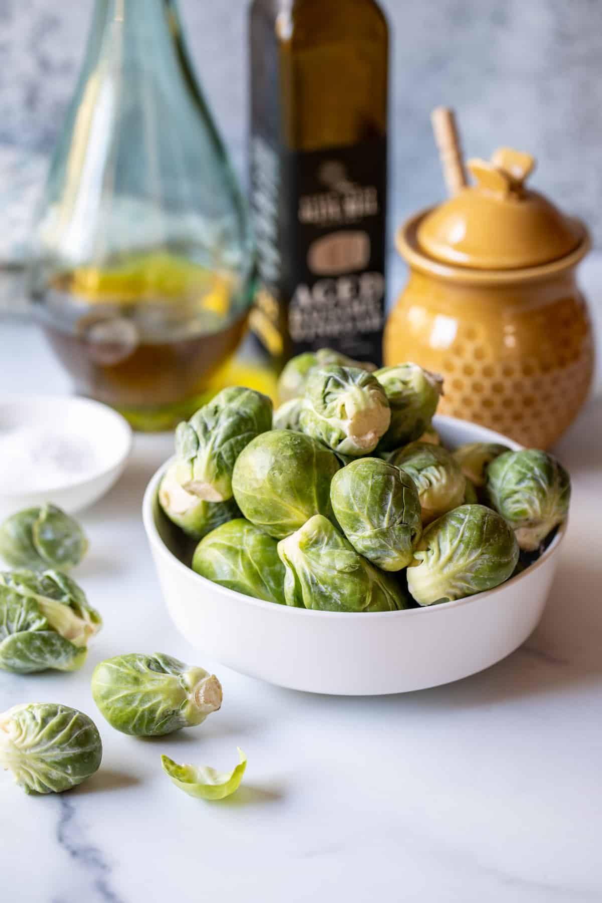 Brussels sprouts in a small white bowl. 