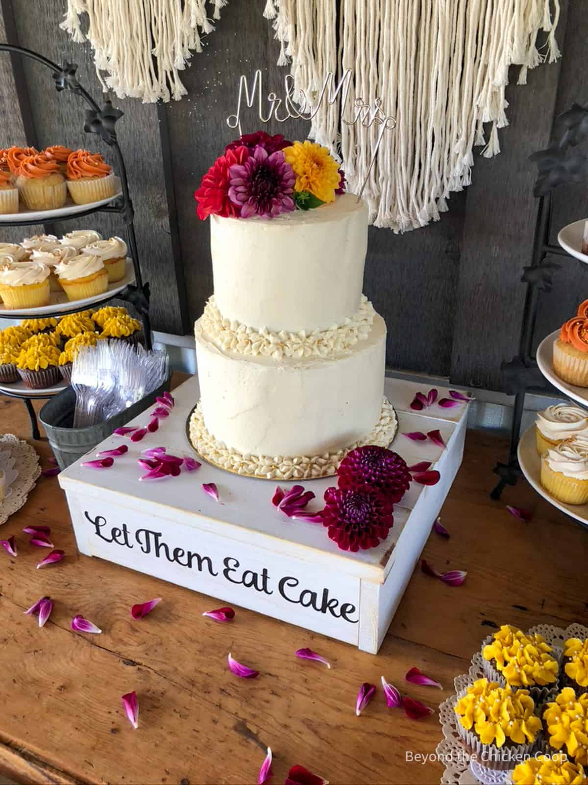A wedding cake with fresh flowers. 