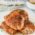 Crispy chicken thighs on a plate.