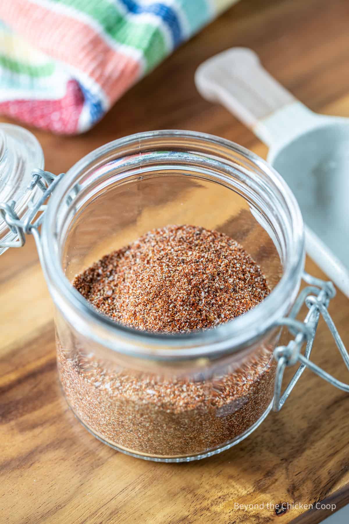 A jar filled with a spice mixture.