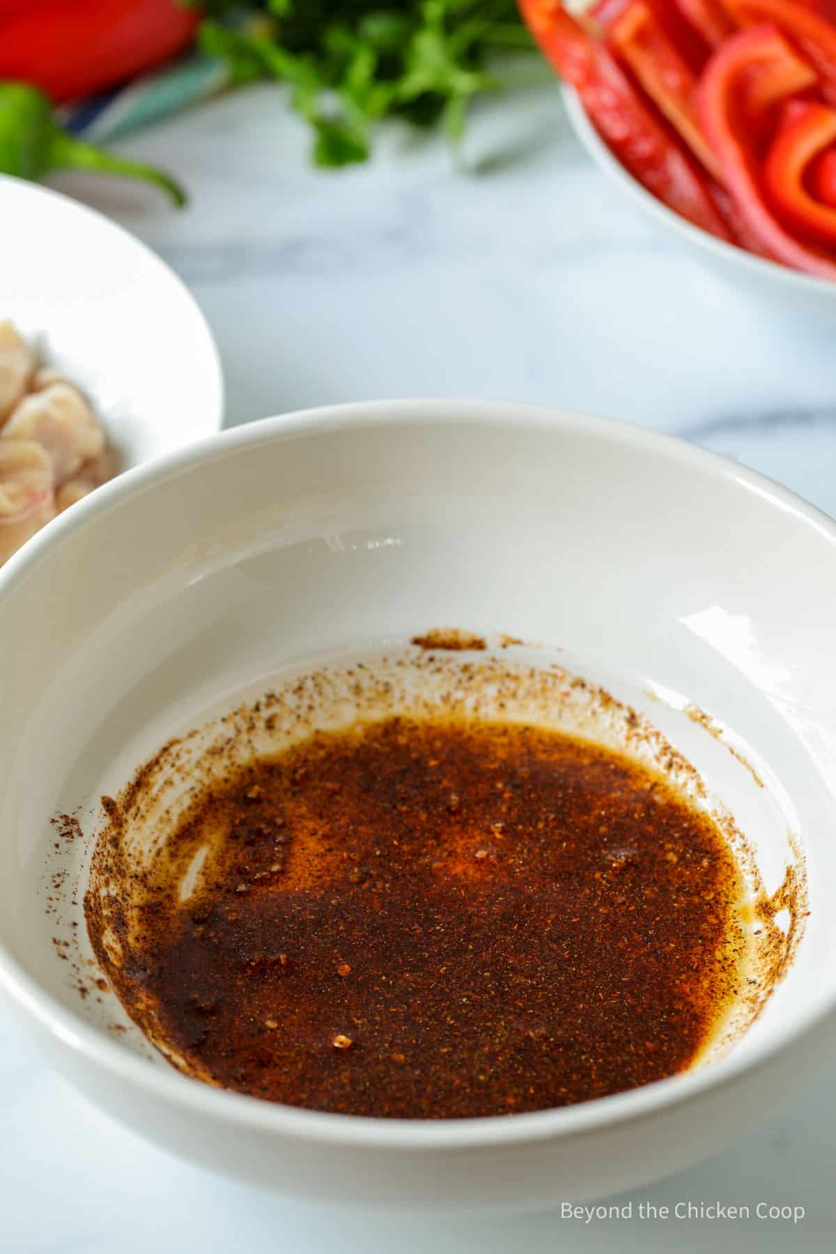 Fajita seasoning in a bowl with oil.