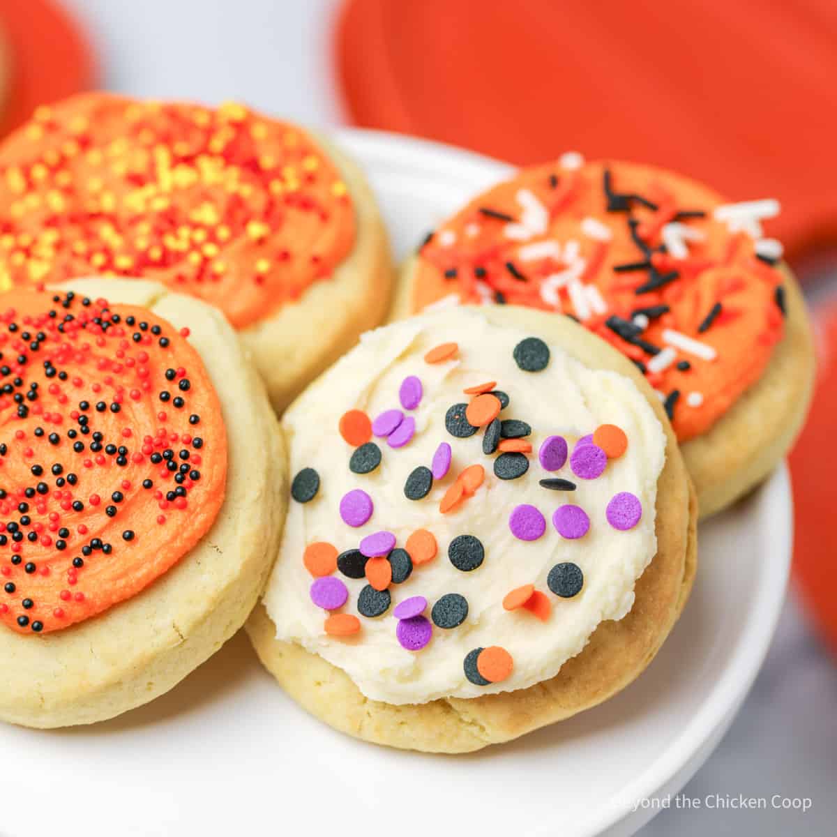 Halloween lofthouse cookies on a white cake stand.