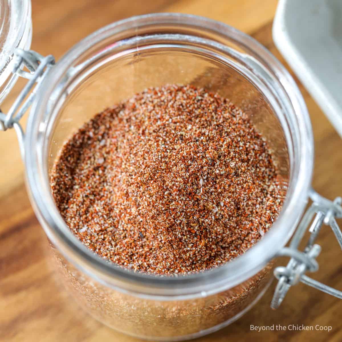 A seasoning blend in a glass crock.