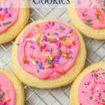 Pink frosted sugar cookies with colorful sprinkles.