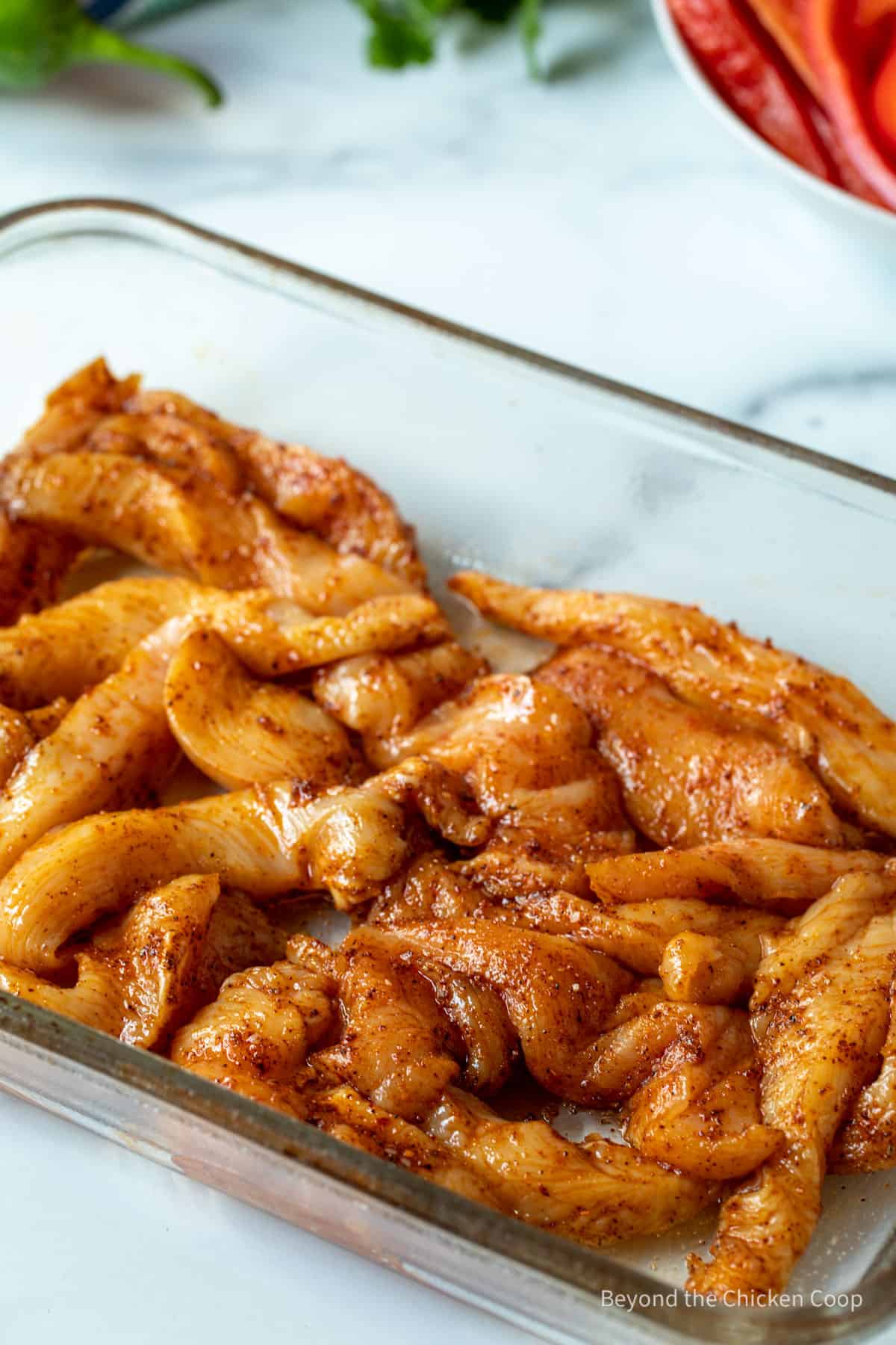 Chicken in a casserole dish.