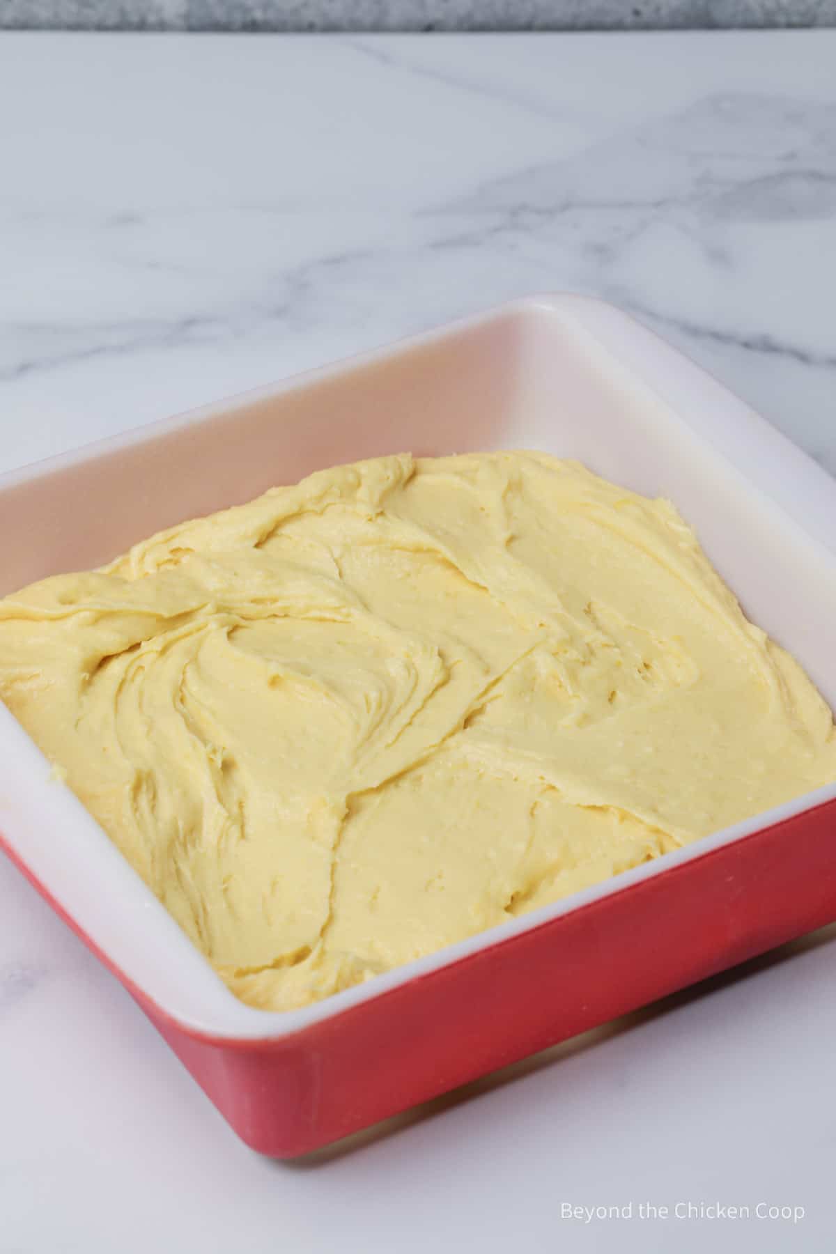 Cake batter in a baking dish.