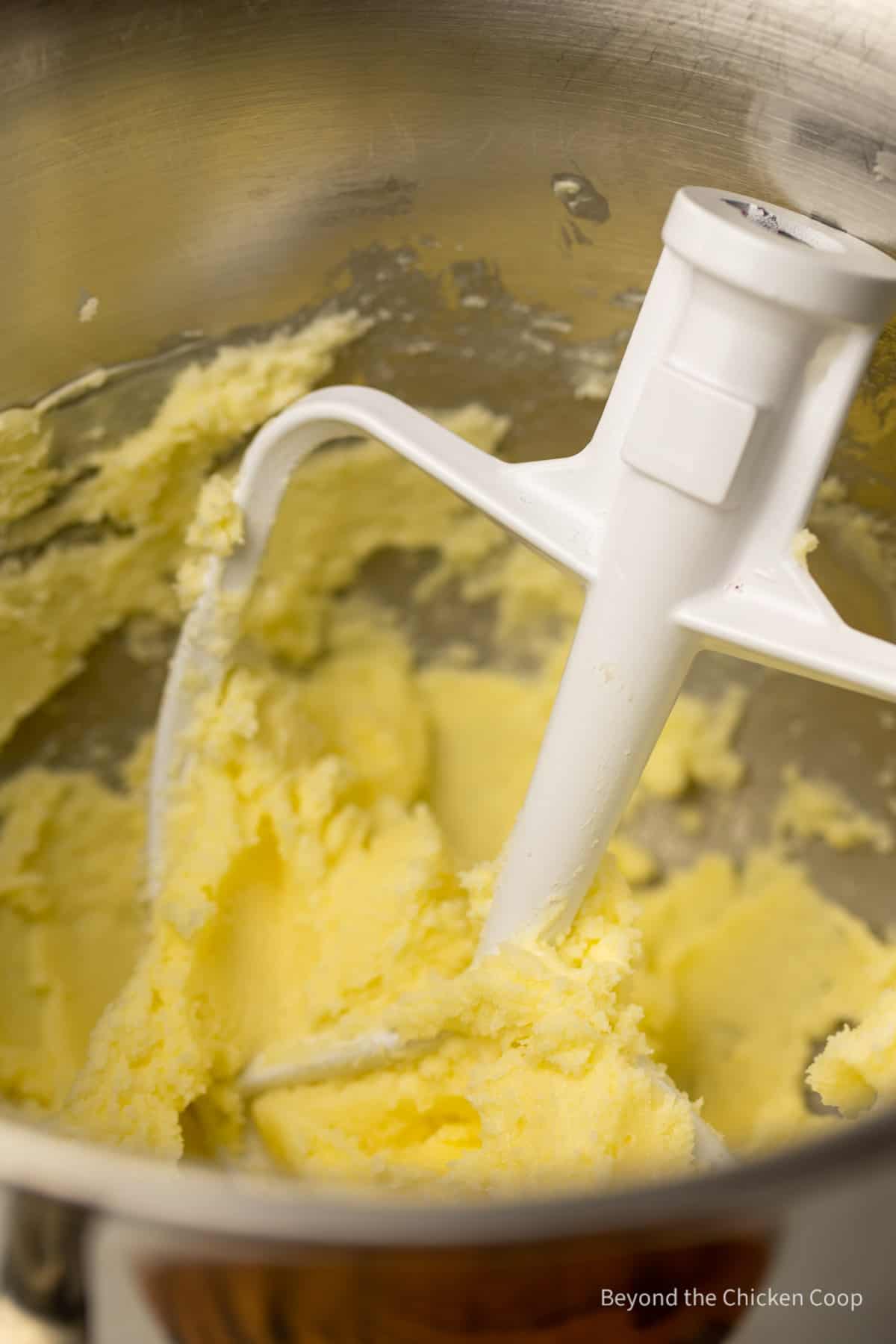 Creamed butter in a mixing bowl.