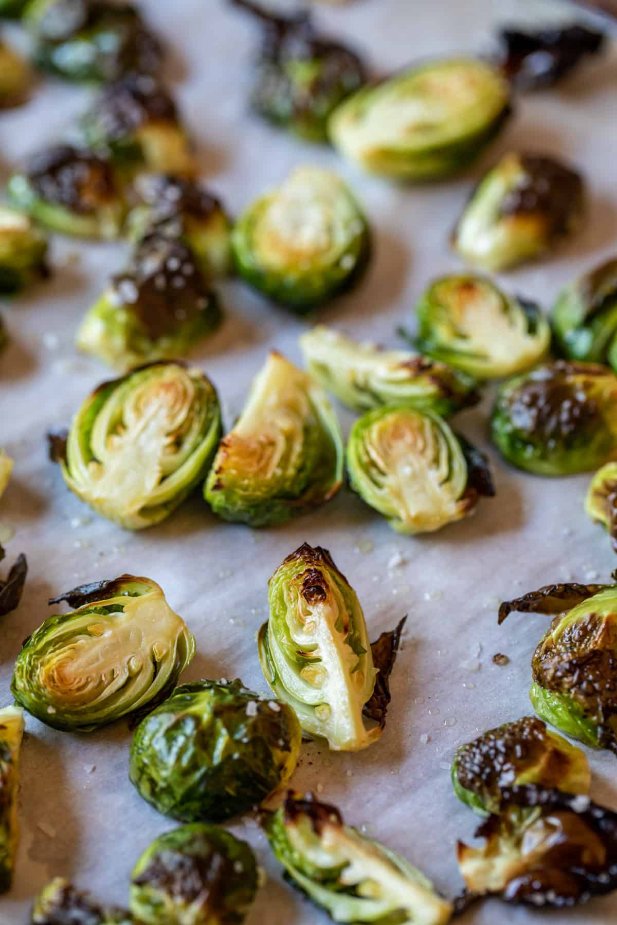 Roasted brussels sprouts on a baking sheet. 