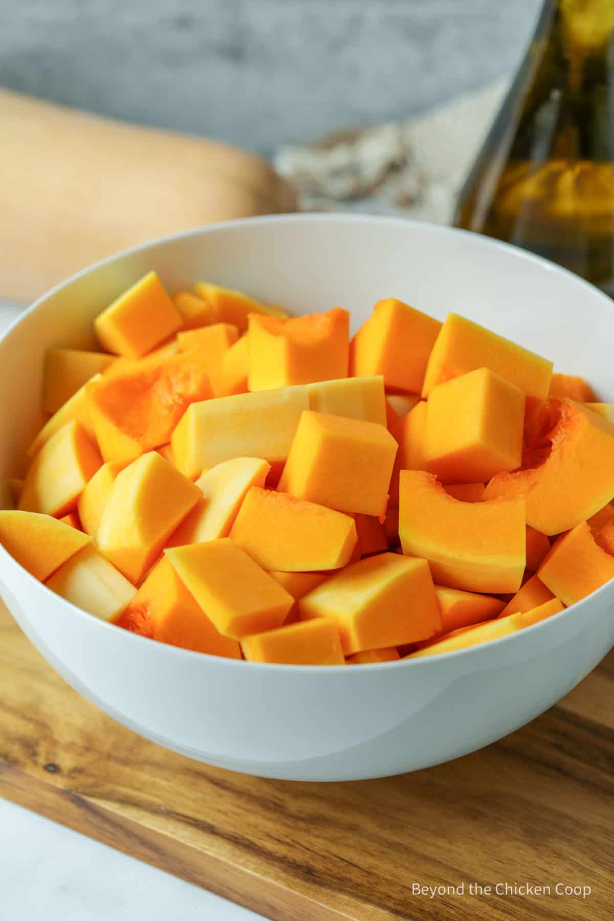 Chopped squash in a white bowl.