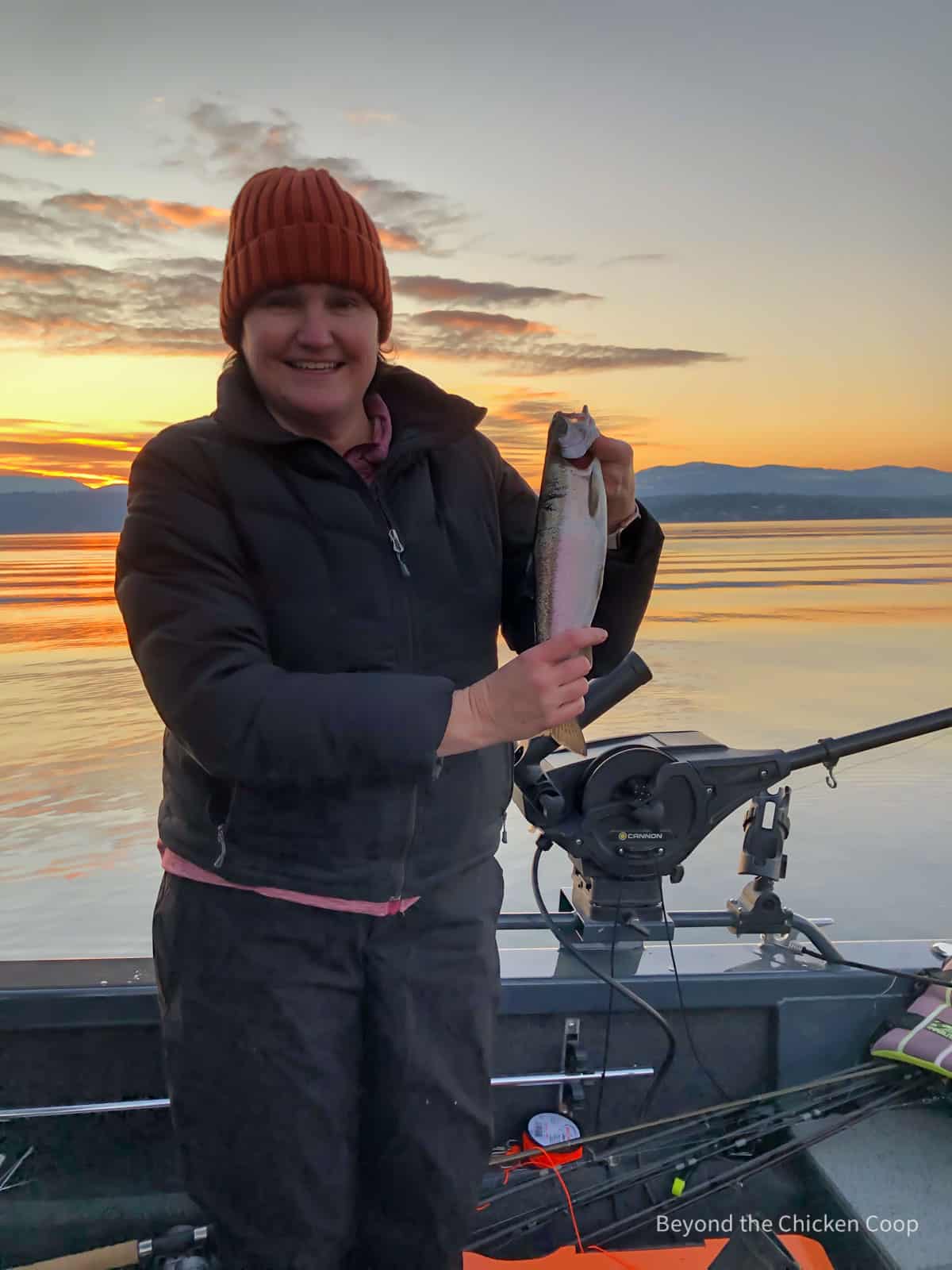 Holding a freshly caught fish. 