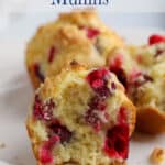 Muffins with cranberries on a plate.