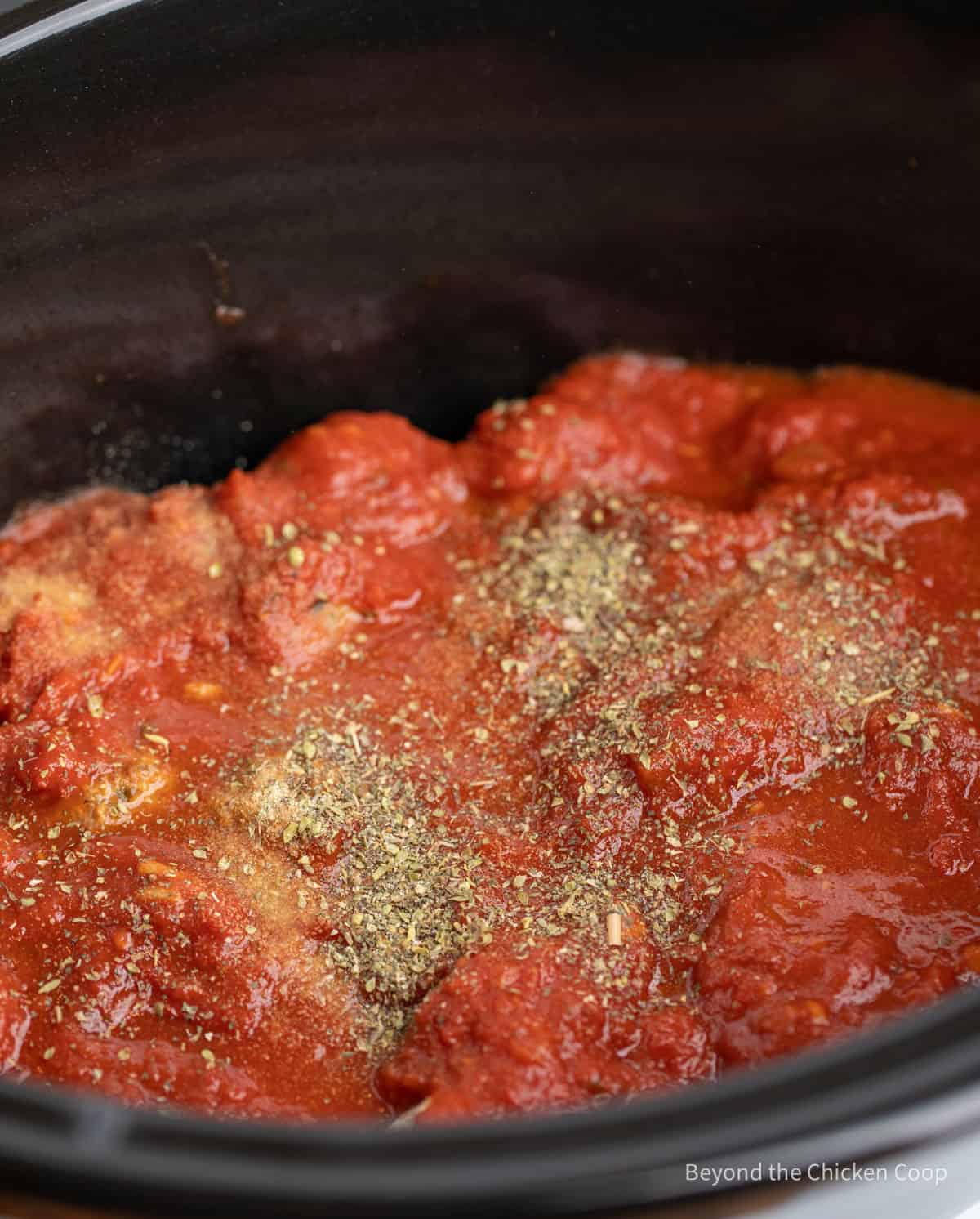 Marinara sauce in a crock pot. 
