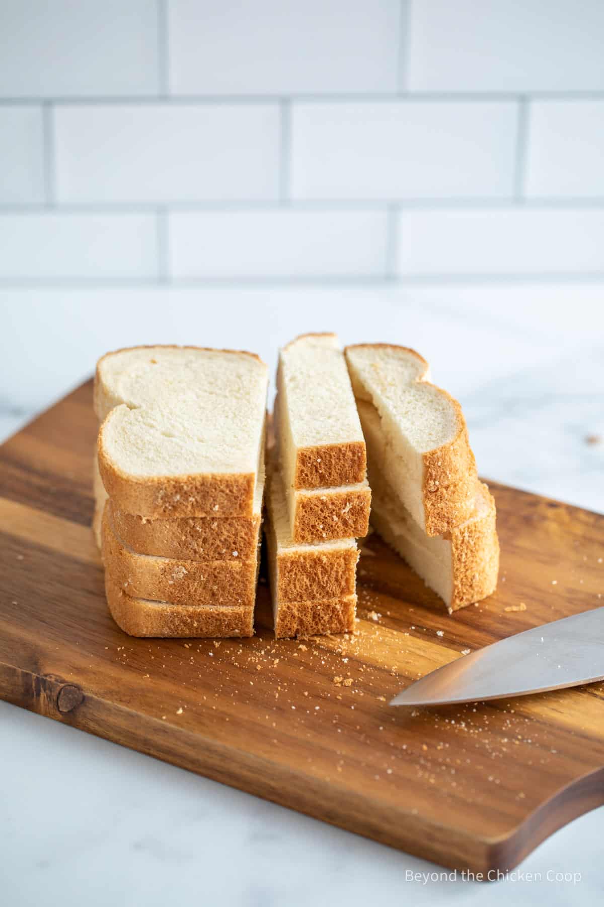 Slicing bread into cubes. 