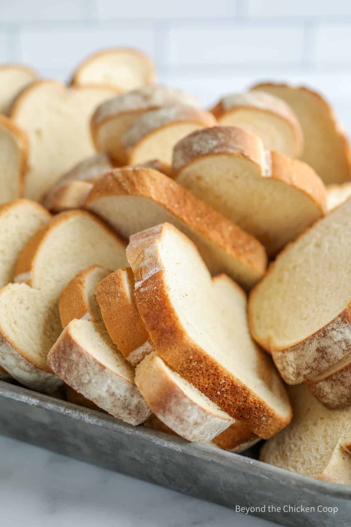Slices of white bread in a pan.