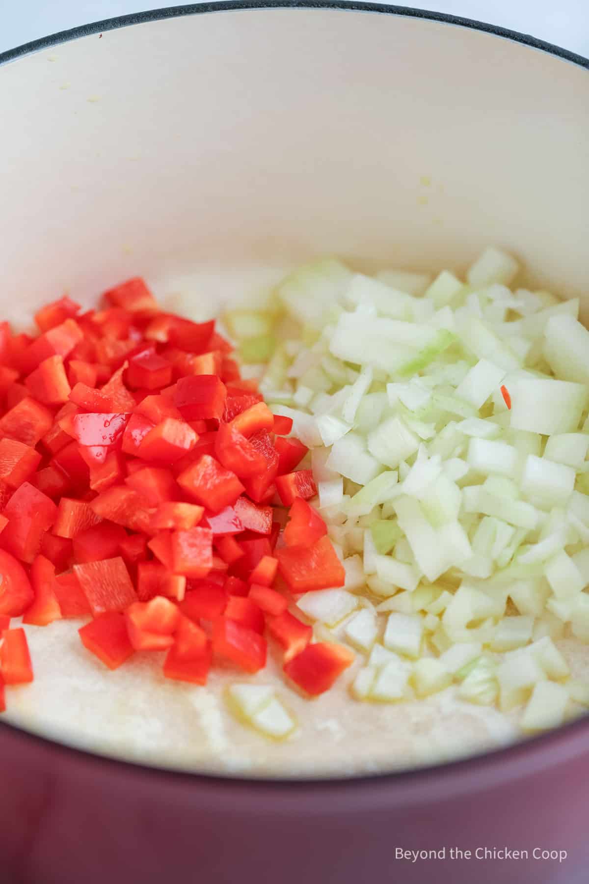 Onions and peppers in a large dutch oven.