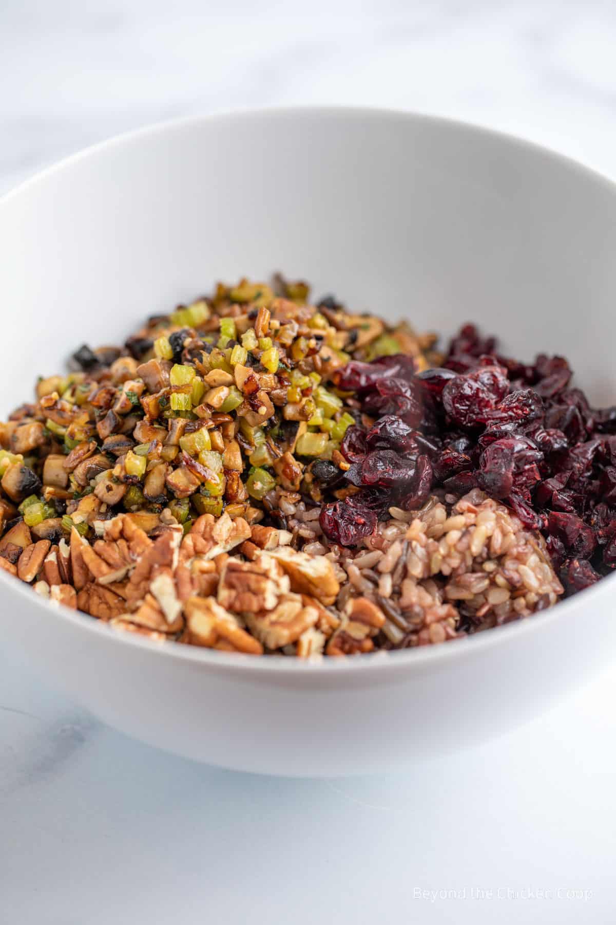 Stuffing ingredients in a white bowl. 