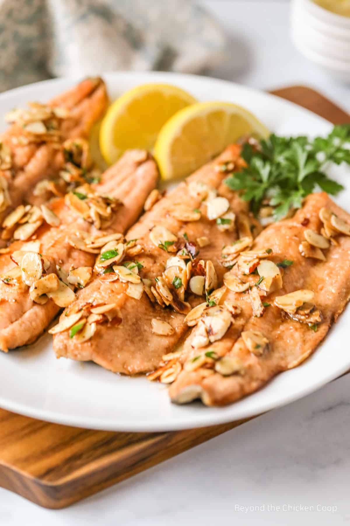 Trout topped with sliced almonds.