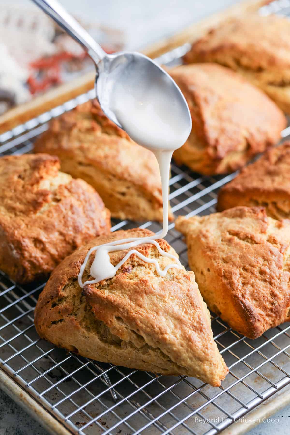 Drizzling a glaze over the top of scones.