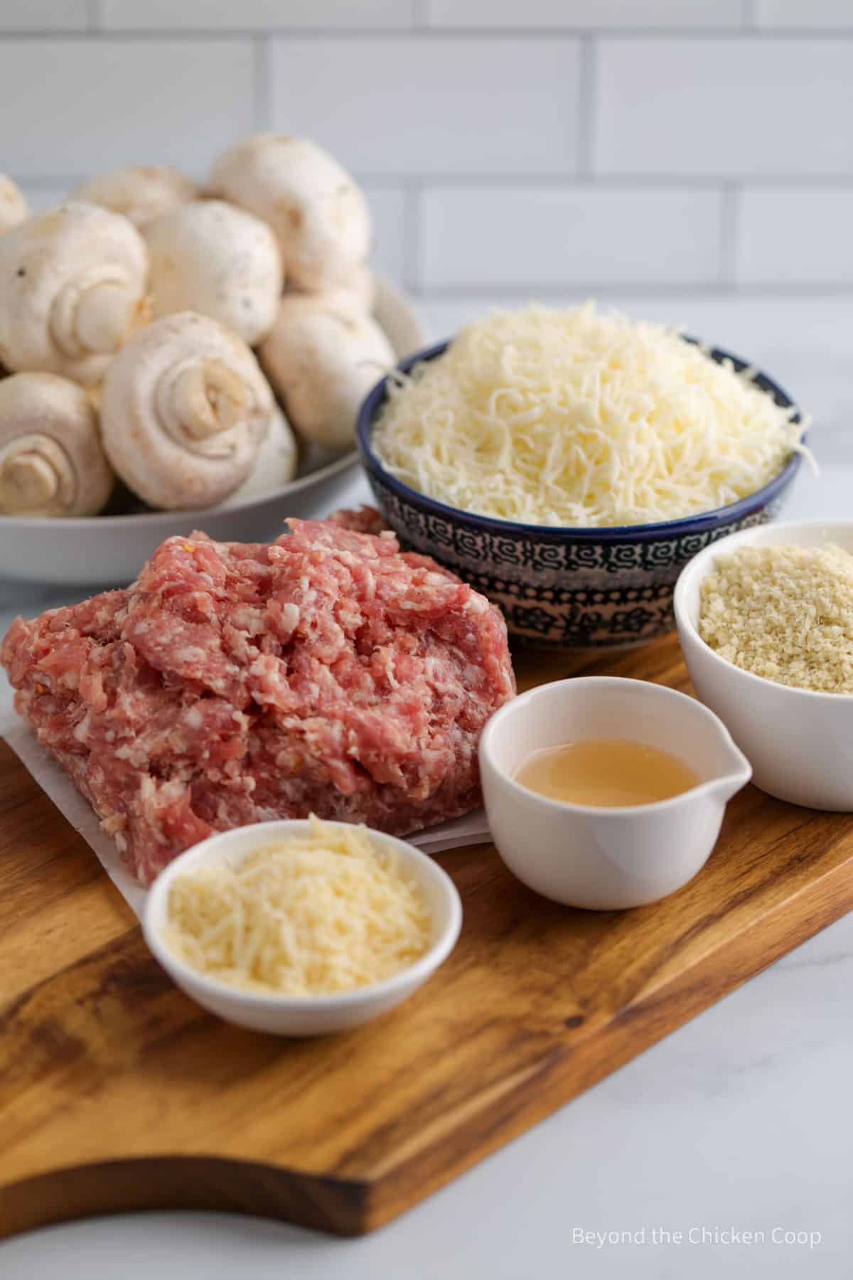 Ingredients for making sausage stuffed mushrooms. 