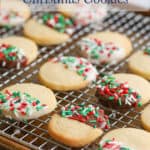 Cookies with chocolate and sprinkles on a baking rack.