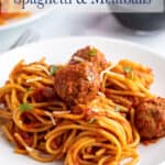 A plate with spaghetti and meatballs.
